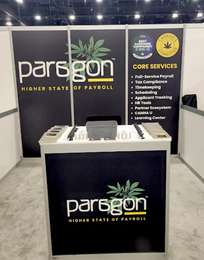 Paragon Payroll's booth, displaying the 'Best Cannabis Companies to Work For 2026' logo, at a recent MJ Unpacked show.