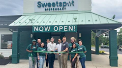 Pictured at the ribbon-cutting ceremony for Sweetspot Hamilton are (from left to right): Fred Dumont, Director of Community and Economic Development for Hamilton; Tom Lew, Vice President of Marketing at Sweetspot; Ben Herbs, Chief Business Development Officer at Sweetspot; Harry Patel, Sweetspot Hamilton owner; and Hamilton Mayor Jeff Martin. They are joined by members of the Sweetspot staff.