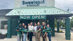 Pictured at the ribbon-cutting ceremony for Sweetspot Hamilton are (from left to right): Fred Dumont, Director of Community and Economic Development for Hamilton; Tom Lew, Vice President of Marketing at Sweetspot; Ben Herbs, Chief Business Development Officer at Sweetspot; Harry Patel, Sweetspot Hamilton owner; and Hamilton Mayor Jeff Martin. They are joined by members of the Sweetspot staff.