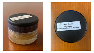 The photos above show medical cannabis concentrate of the strain “Deep Sea” as sold and packaged by Ganja World in 14-gram baller jars.