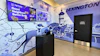 High Profile Cannabis retail storefront interior with blue-themed Lexington mural, digital menu board, and service counter