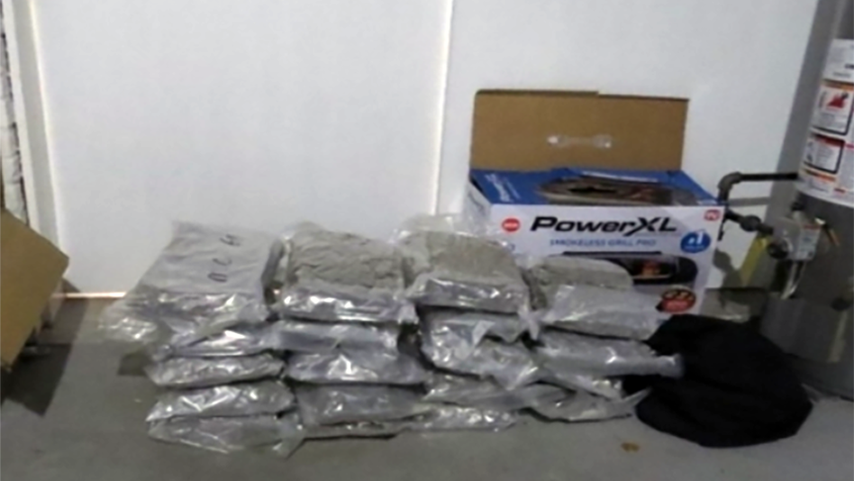 Multiple plastic-wrapped packages and PowerXL branded box arranged on table surface