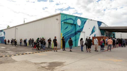 The line wraps around the building outside Perfect Union Northside during the 420 event.