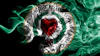 Worcester City Football Club circular emblem with red heart, green wreath, and gold border on black background